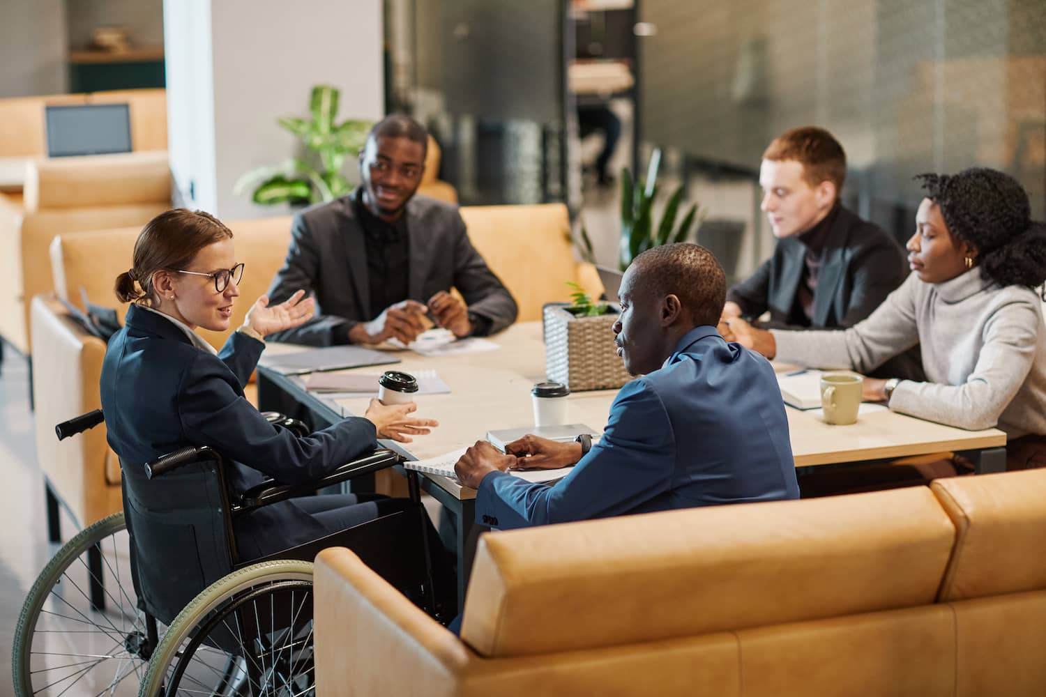 A group of diverse employees having a discussion.