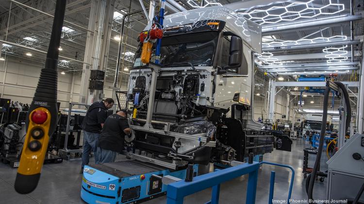 Workers at Nikola's Coolidge manufacturing facility assembling the company's semitrucks on April 28, 2022.